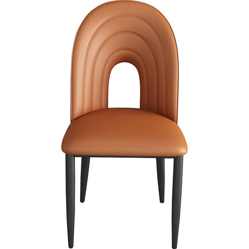 a brown chair with a curved back and wooden legs