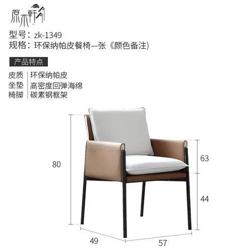 a white chair with a black frame and a beige seat