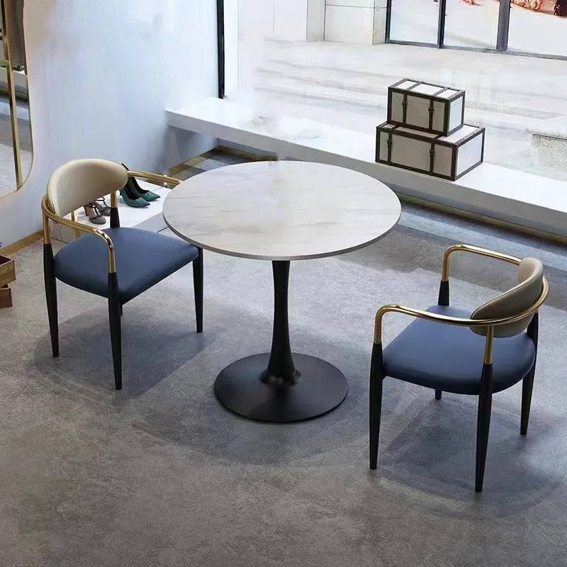 a white table and two chairs in a room