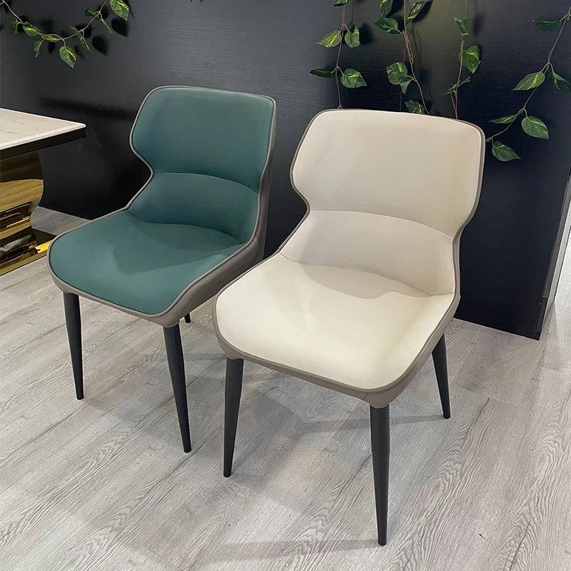 a couple of chairs sitting on top of a hard wood floor