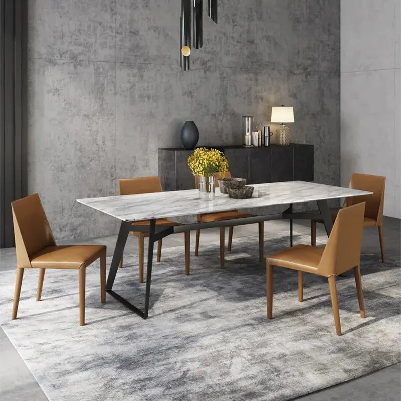 a dining room with a table and chairs
