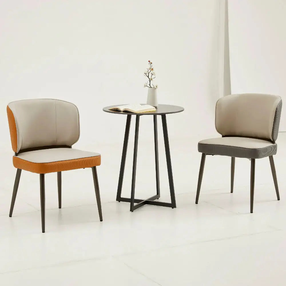 three chairs and a table in a room