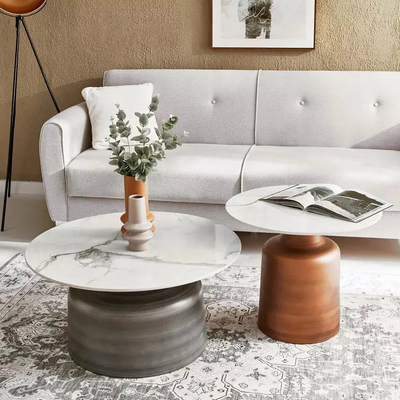 a living room with a white couch and a coffee table