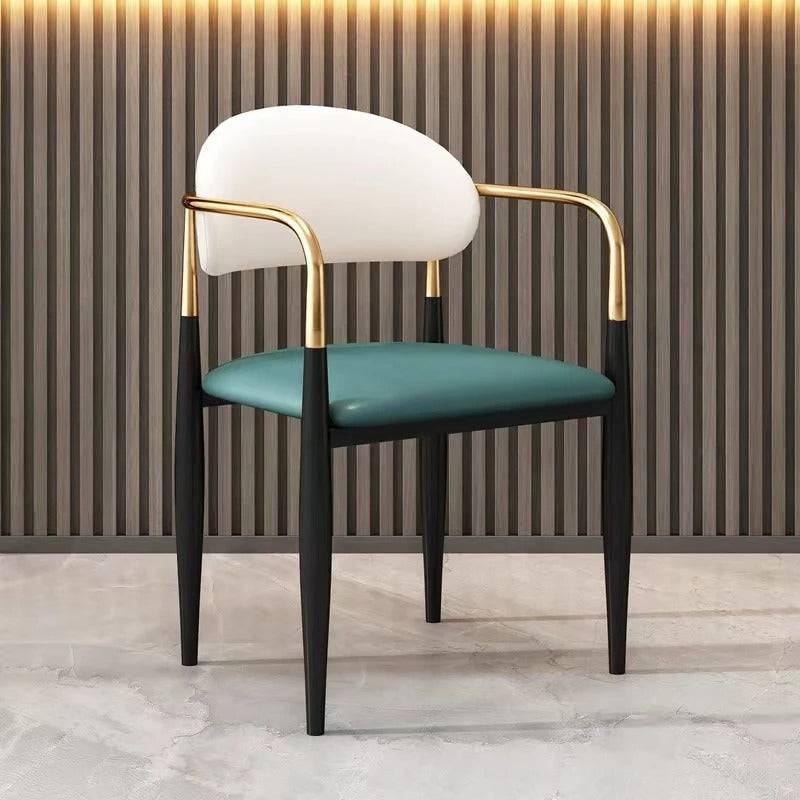 a chair with a green seat and a gold arm rest