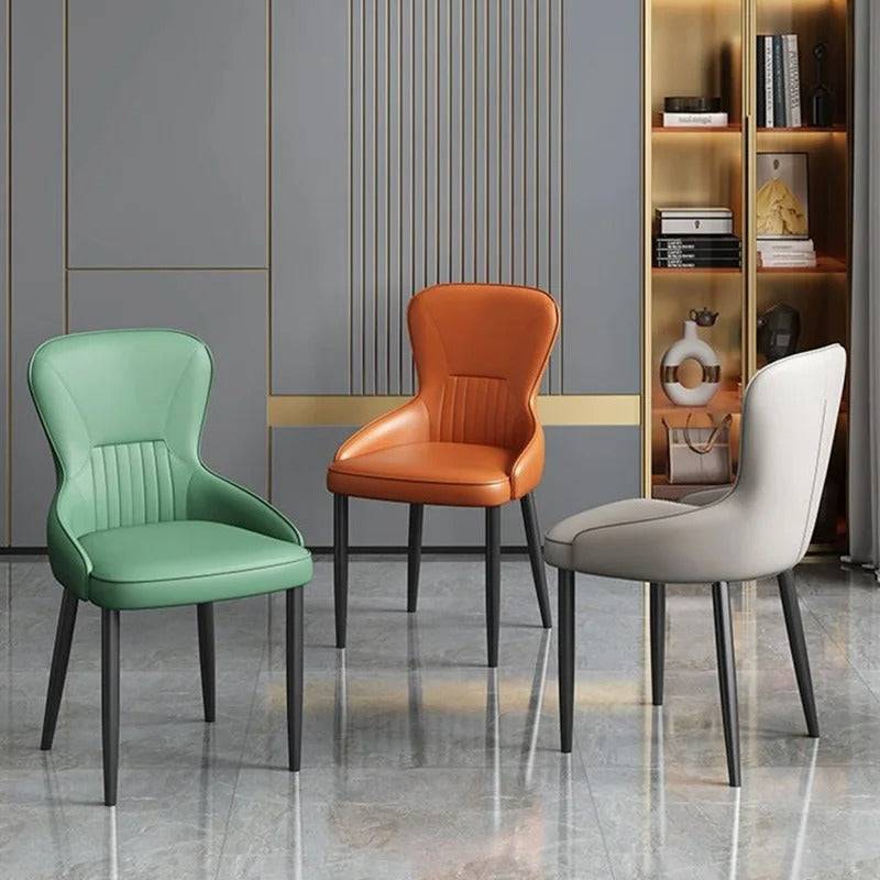 a group of chairs sitting next to each other in a room