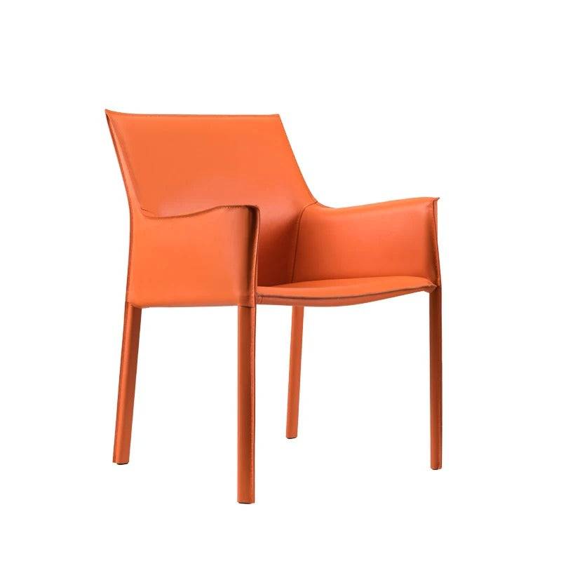 an orange chair sitting on top of a white floor