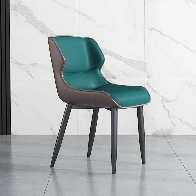 a blue chair sitting in front of a marble wall