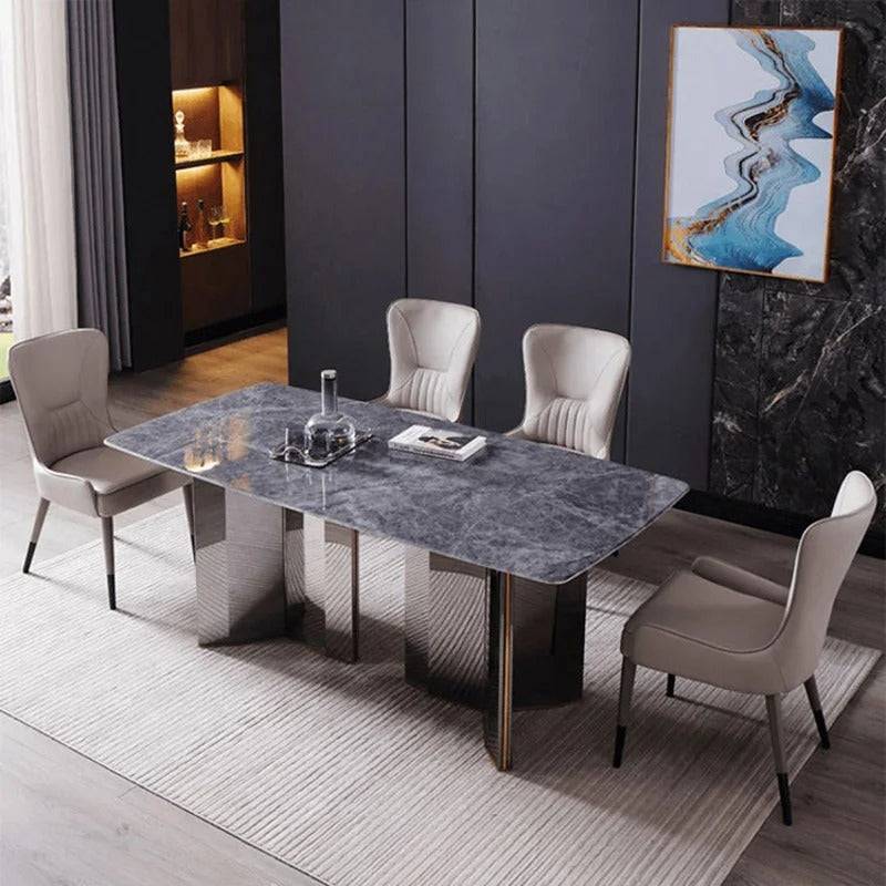 a dining room with a marble table and chairs