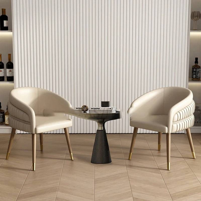a couple of chairs sitting next to a table