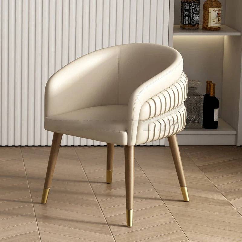 a white chair sitting on top of a wooden floor