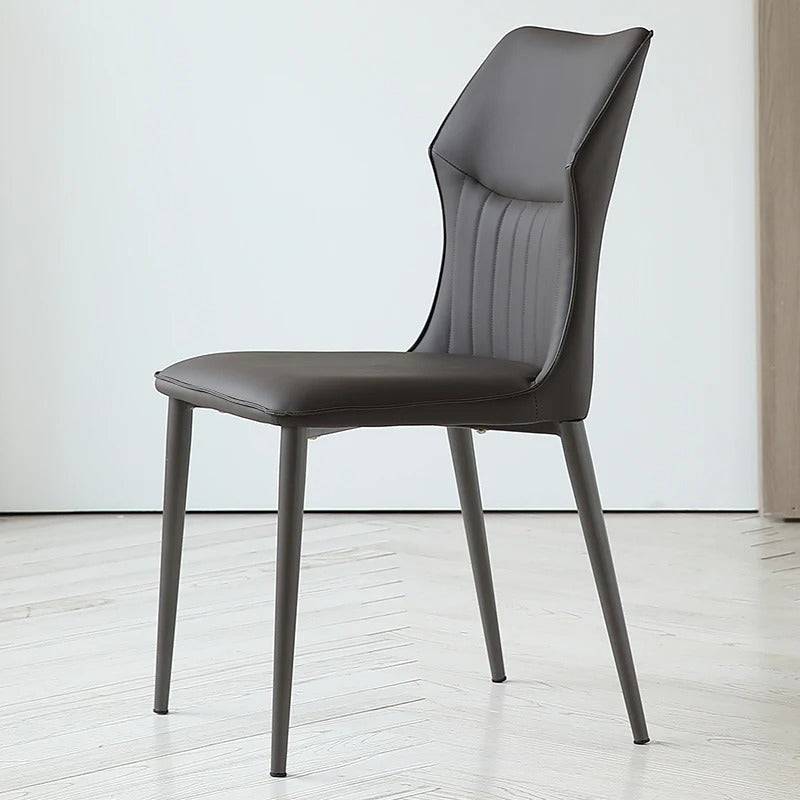a black chair sitting on top of a hard wood floor