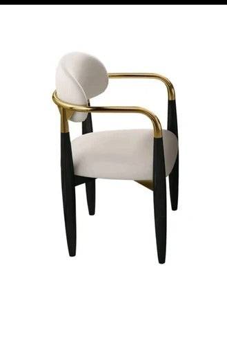 a white chair with a gold frame and black legs