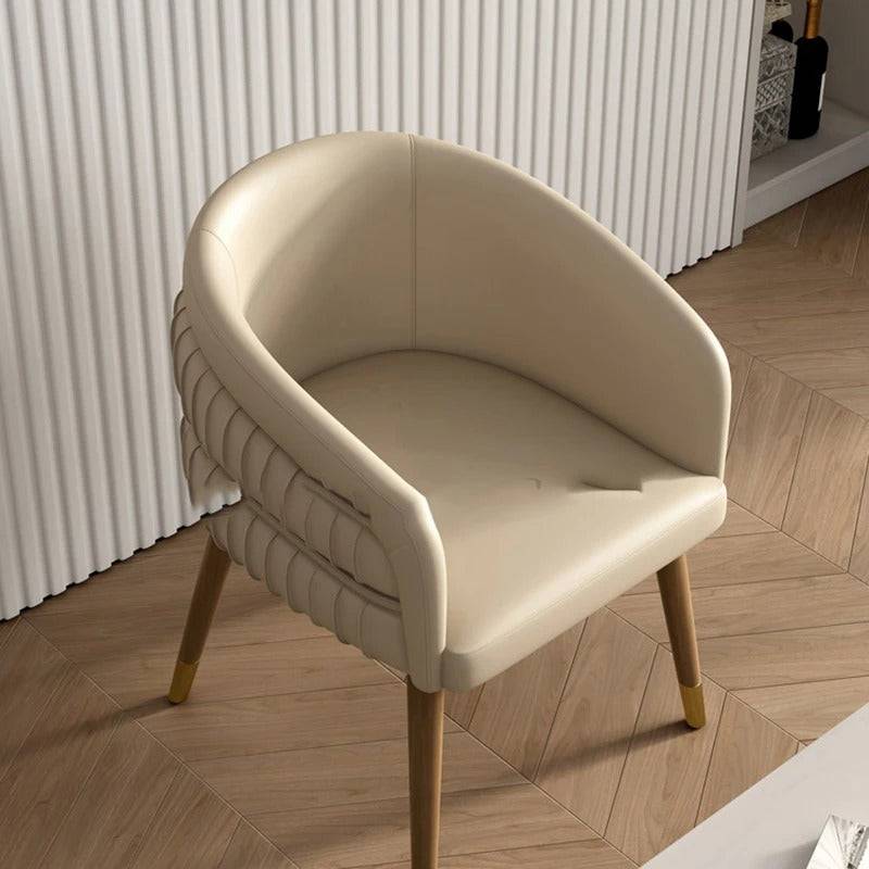 a white chair sitting on top of a hard wood floor