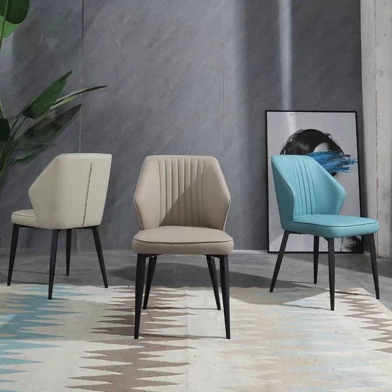 a group of three chairs sitting next to each other