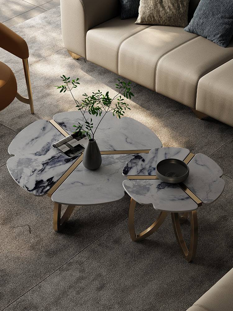 a living room with two tables and a couch