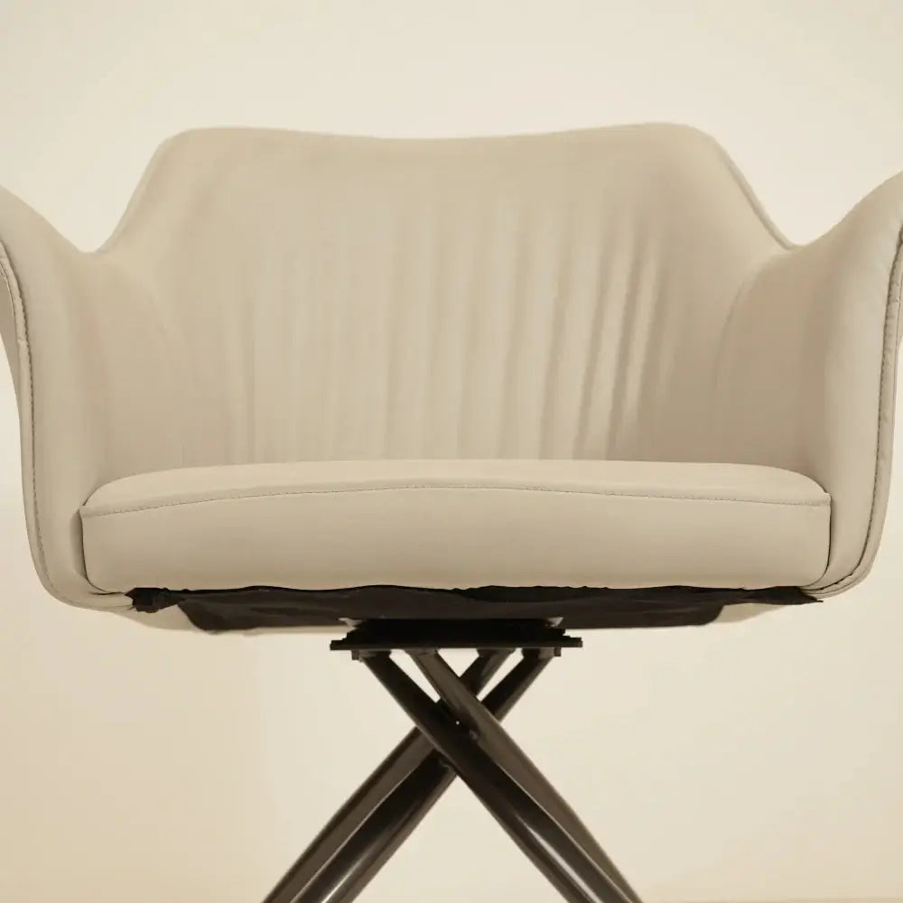 a white chair sitting on top of a metal base