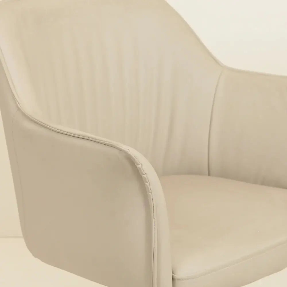 a white leather chair with a white background