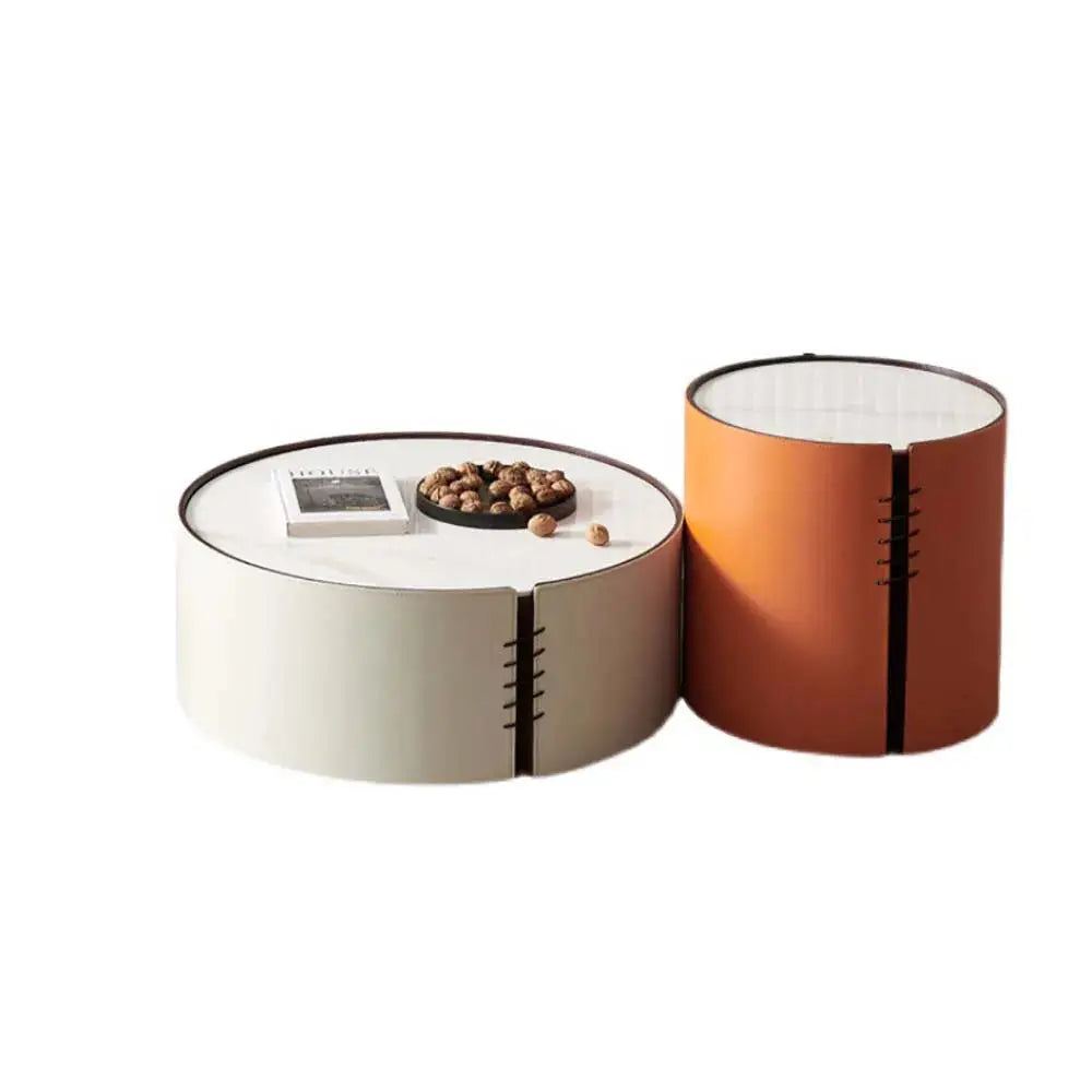 a white and orange coffee table sitting next to each other