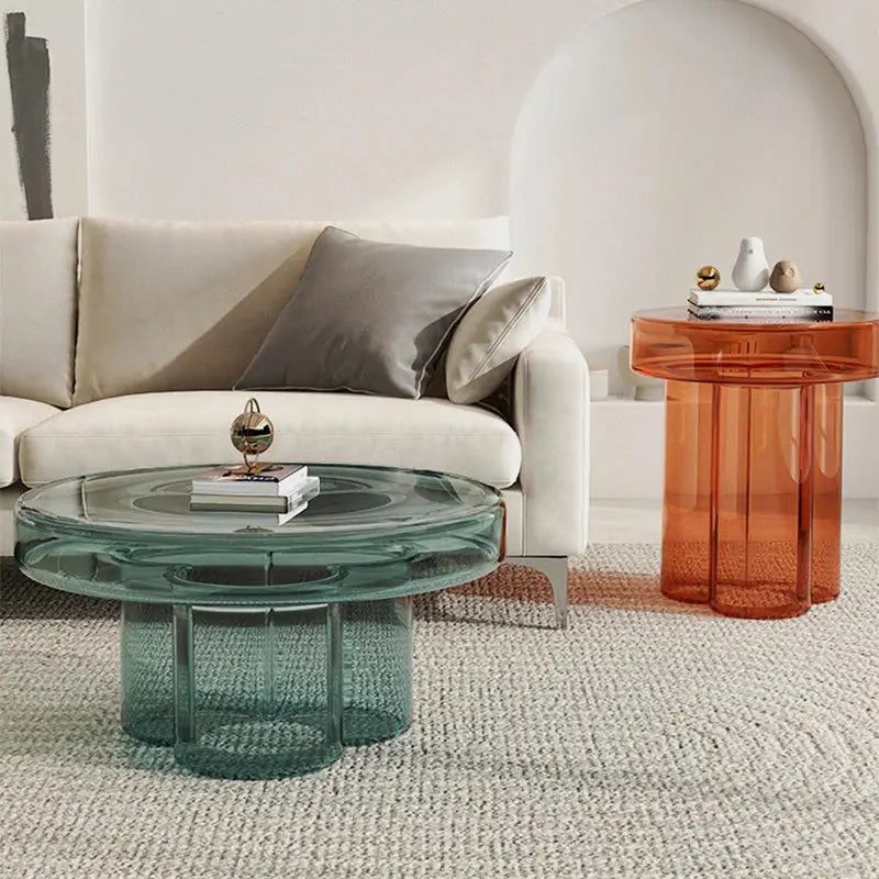 a living room with a couch and a glass table