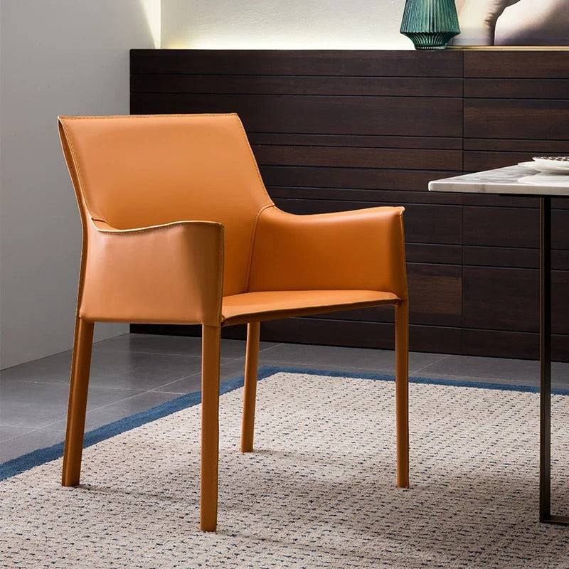 a chair sitting on top of a rug next to a table
