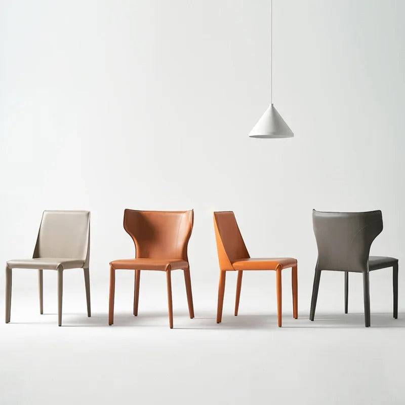 a group of four chairs sitting next to each other