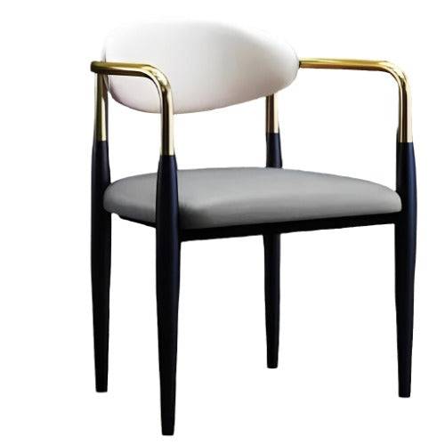 a black and white chair with a gold frame
