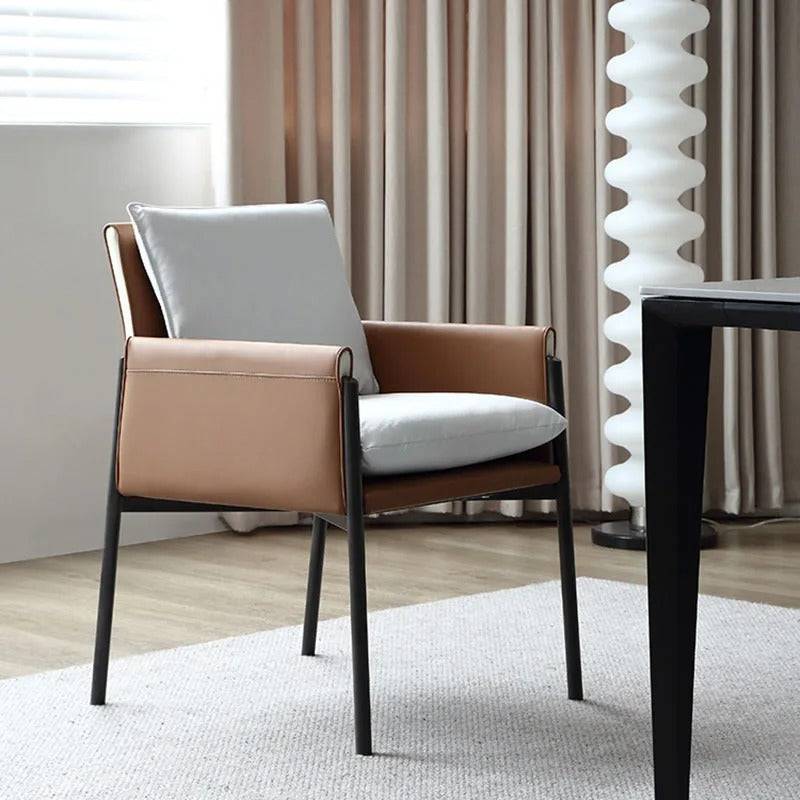 a chair sitting in front of a window next to a table