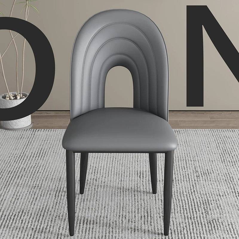 a chair sitting in front of a wall with a number on it