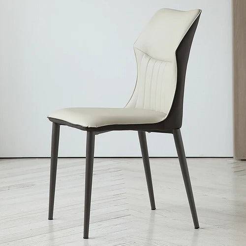 a white chair sitting on top of a hard wood floor