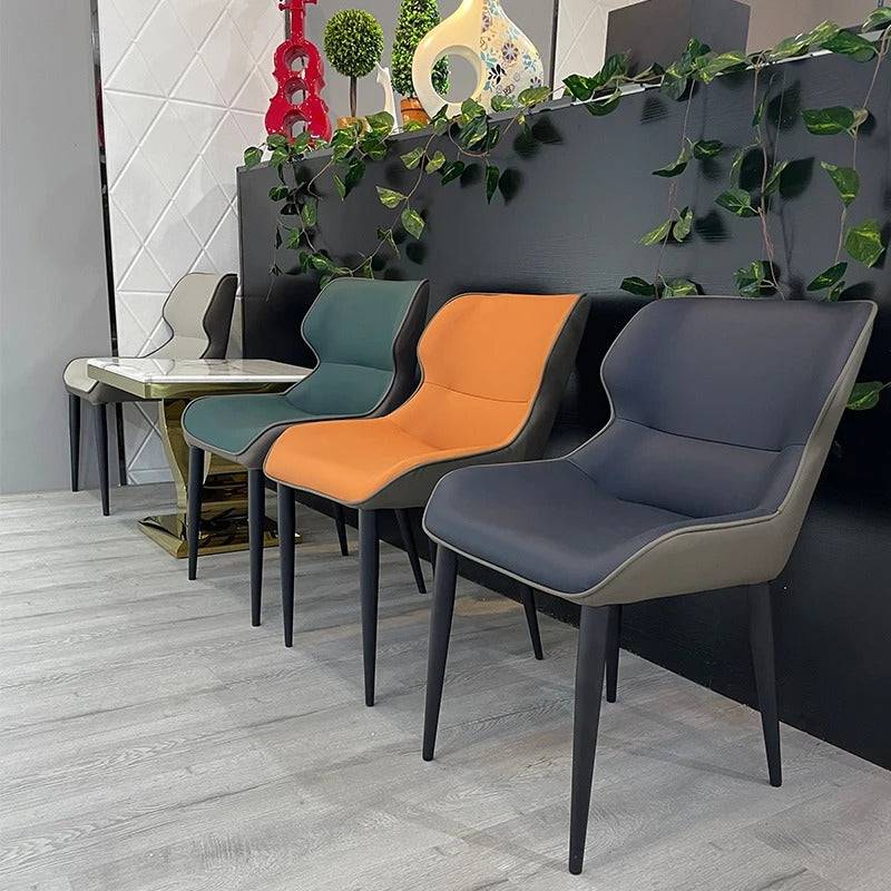 a row of chairs sitting next to each other in front of a wall