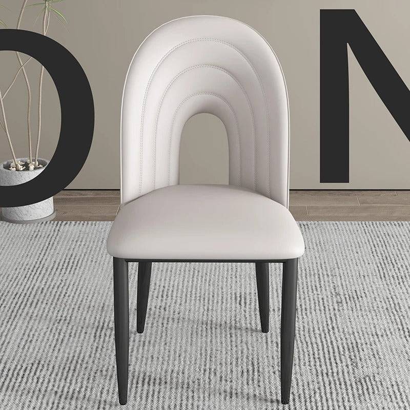 a white chair sitting on top of a rug