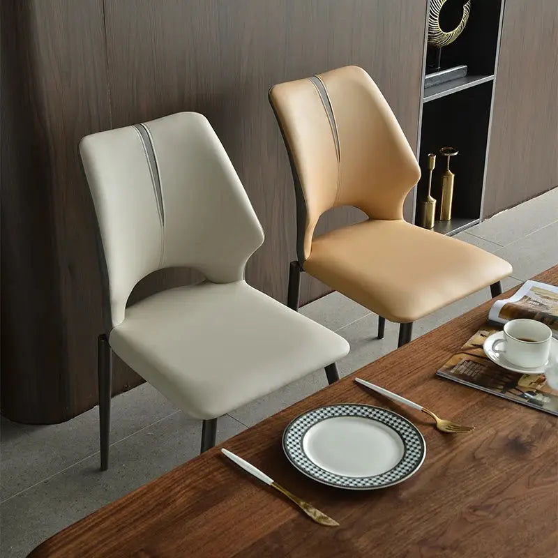 a couple of chairs sitting on top of a wooden table