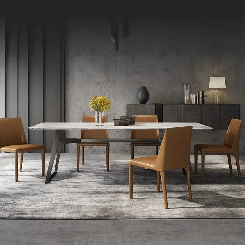 a dining room with a table and chairs