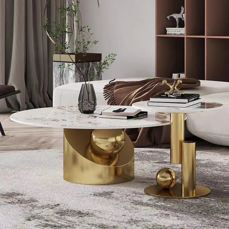 a living room with a white couch and a gold coffee table