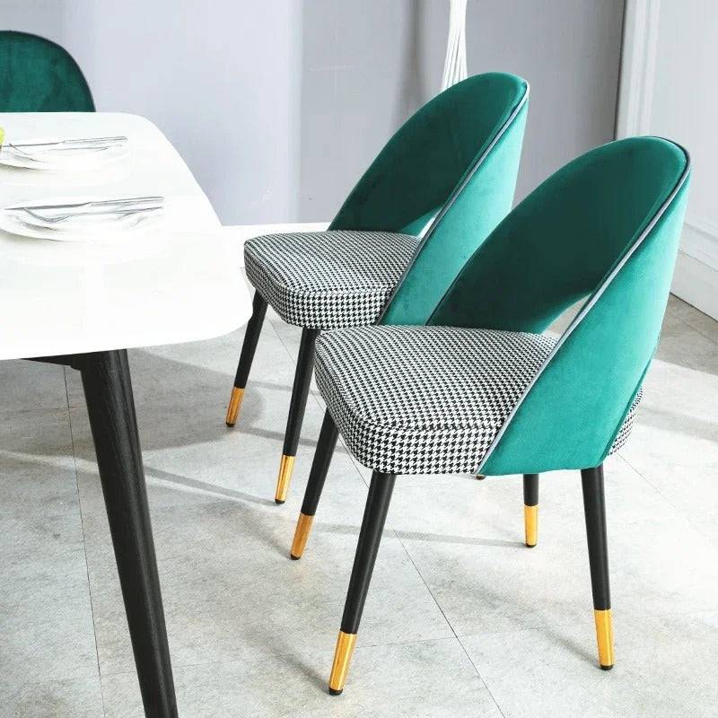 a dining table with four chairs and a white table