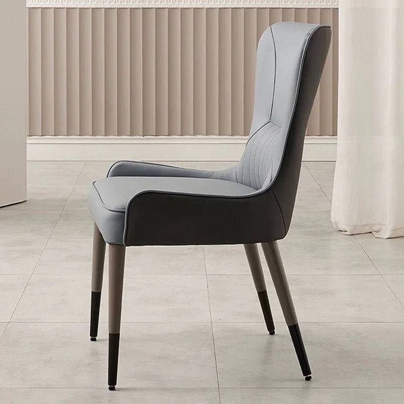 a chair sitting in a room next to a window