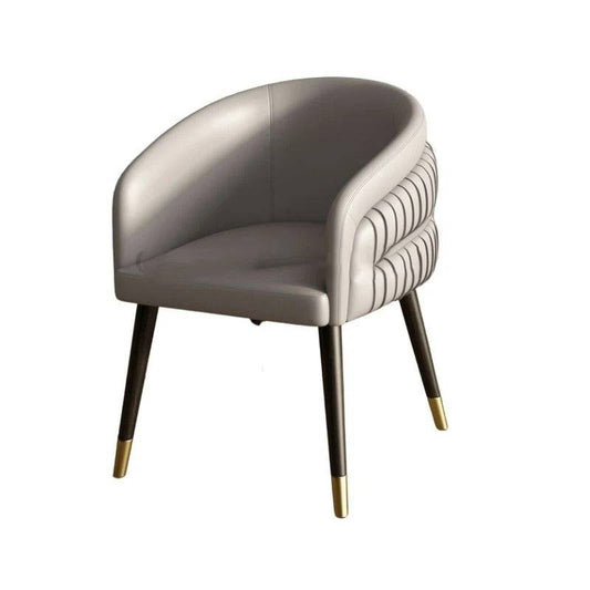 a grey chair with gold legs on a white background