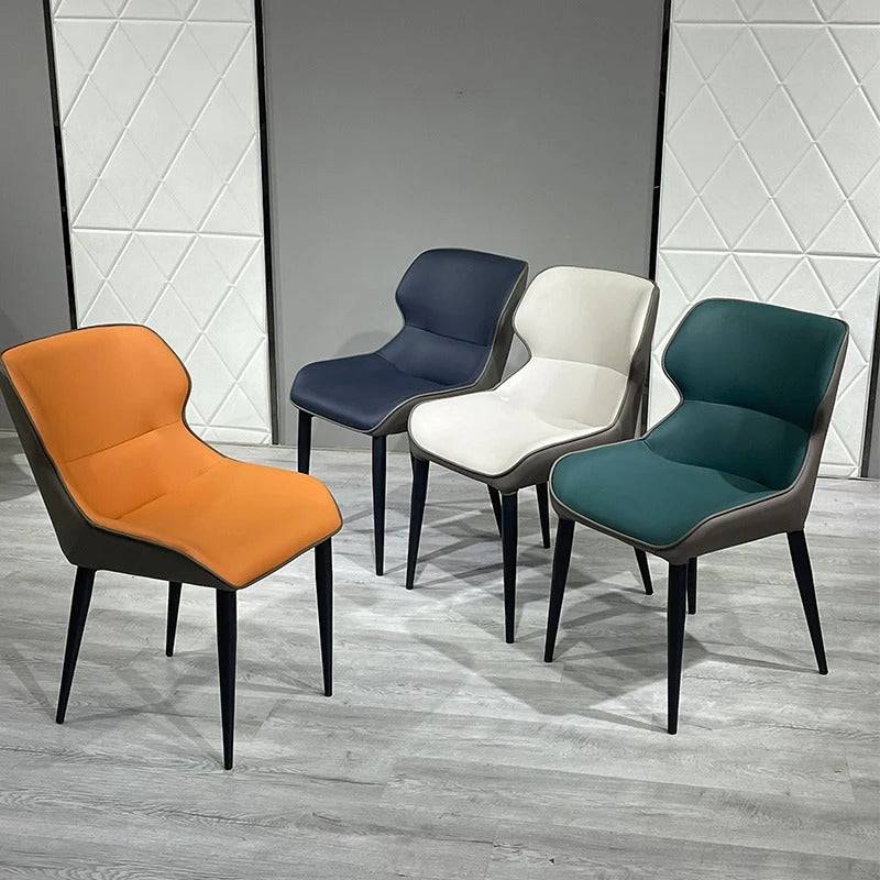 a group of four chairs sitting next to each other