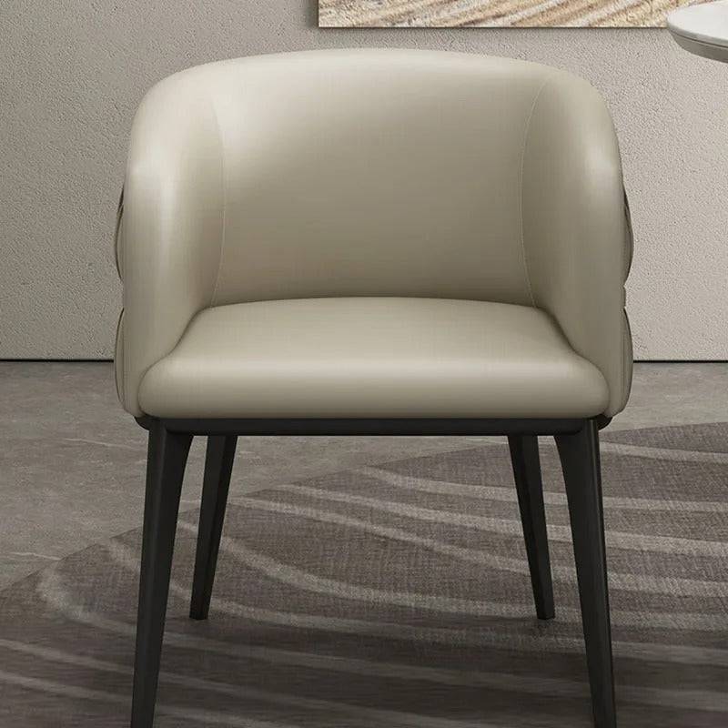 a white chair sitting in a room next to a table