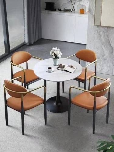 a round table with four chairs around it