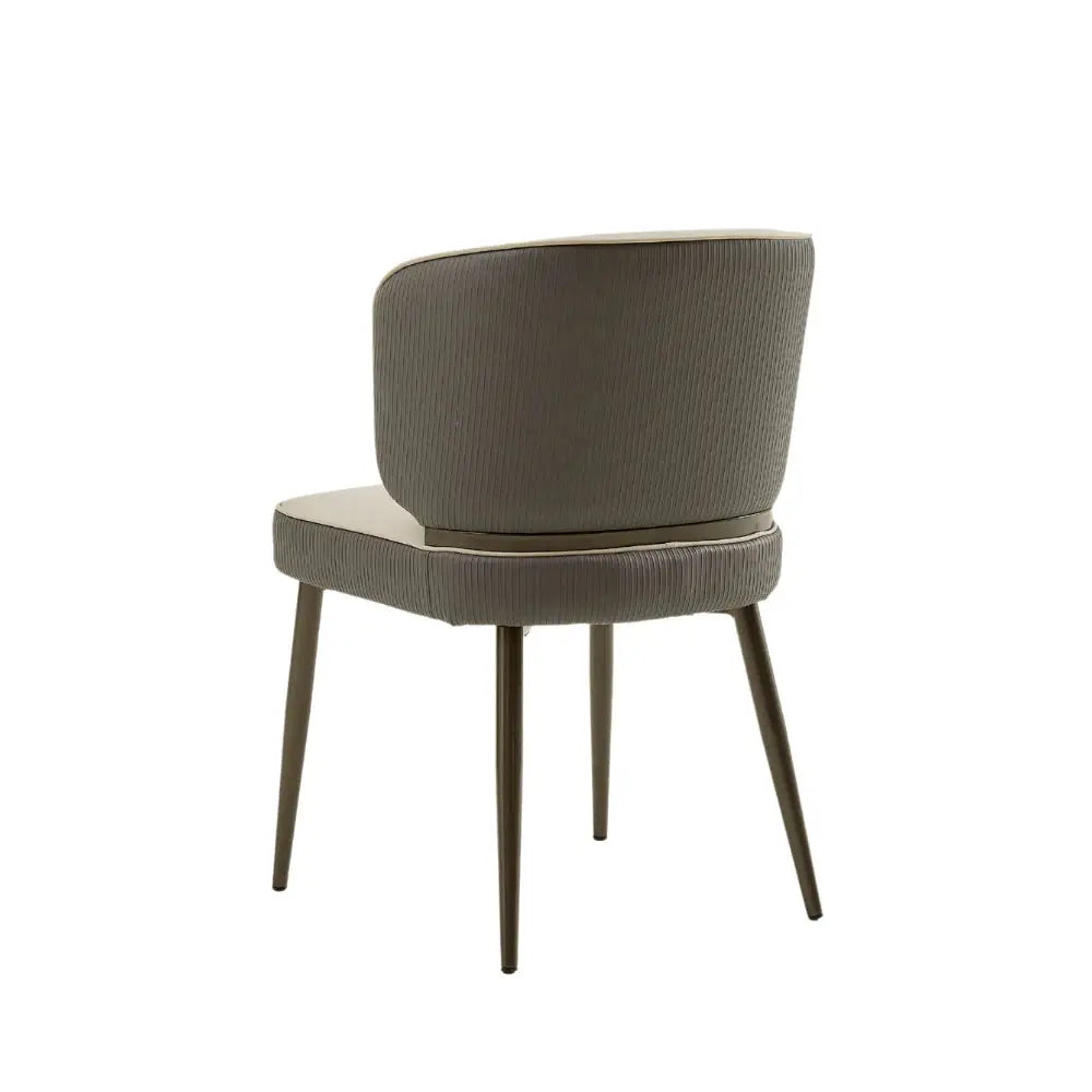 a gray chair with wooden legs and a white background