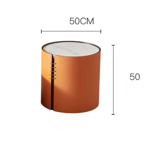 a round metal table with a white top