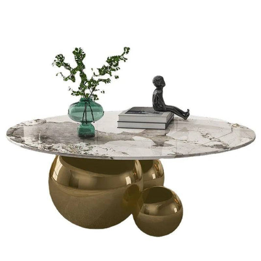 a table with a vase of flowers on top of it